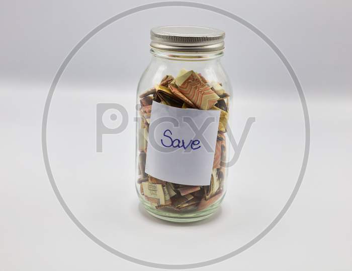 saving money in the glass with background