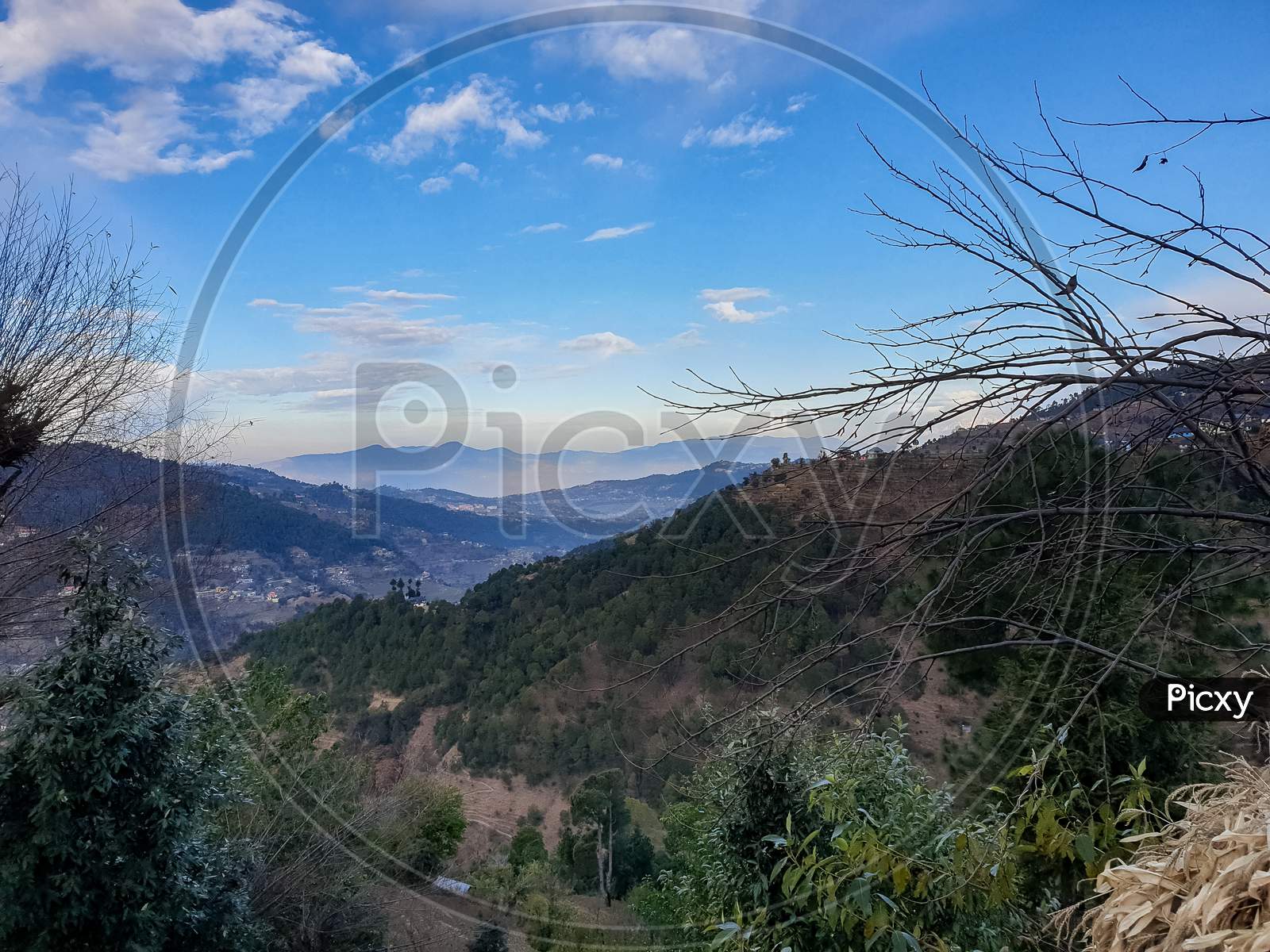 View of morning landscape with beautiful mountains and blue sky in hilly area of Himachal pradesh, India