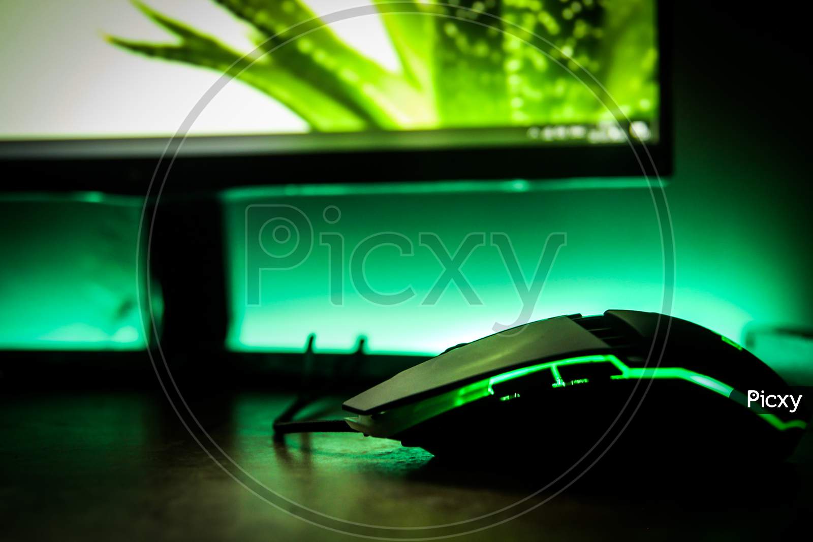 Gaming mouse for desktop, Gaming desktop setup with RGB colors, selective focus on object with blurred background