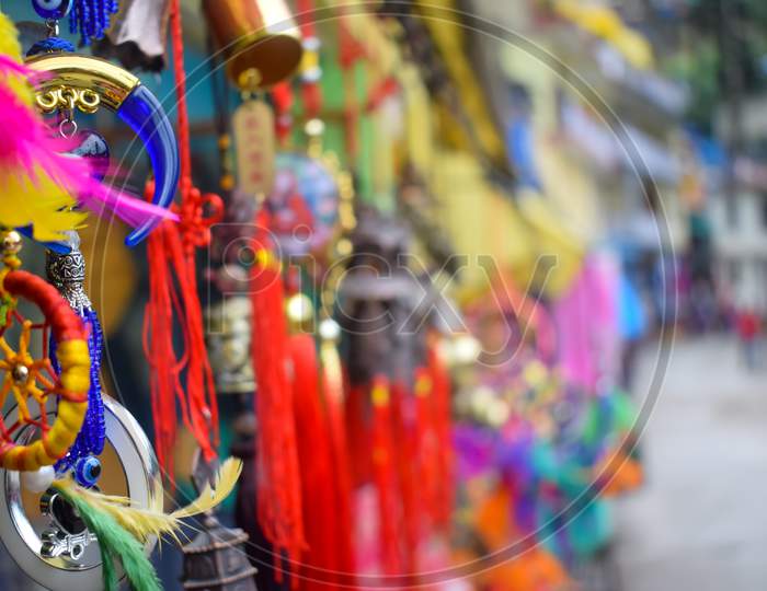 Beautiful wind chimes hanging on street  in the traditional Tibetan market at Dharamsala McLeod Ganj-Selected focus on wind chime  or object