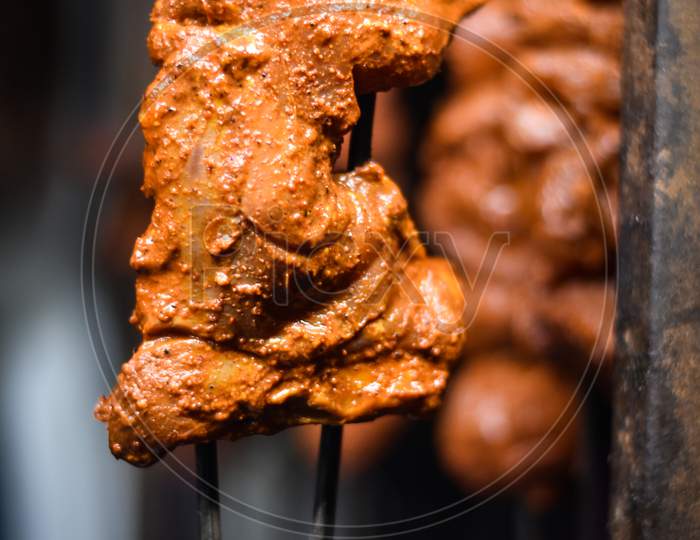 Indian roasted chicken meat on the Indian street market with blur background