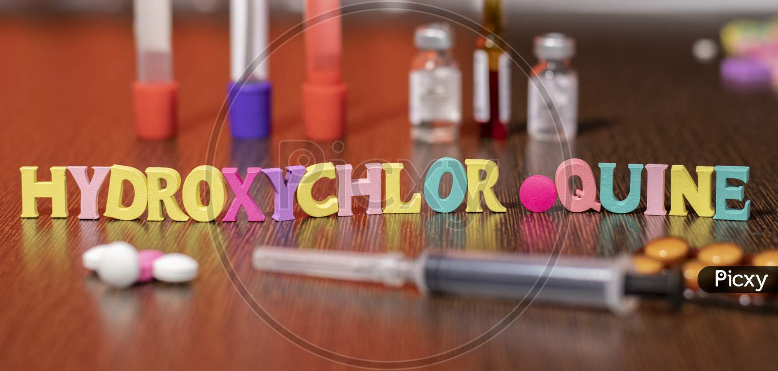 Hydroxychloroquine Or Hcq Drug In Colourful Letters On Table Used For Malaria.