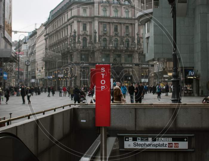 A stop sign at the entrance of metro station Stephanplatz