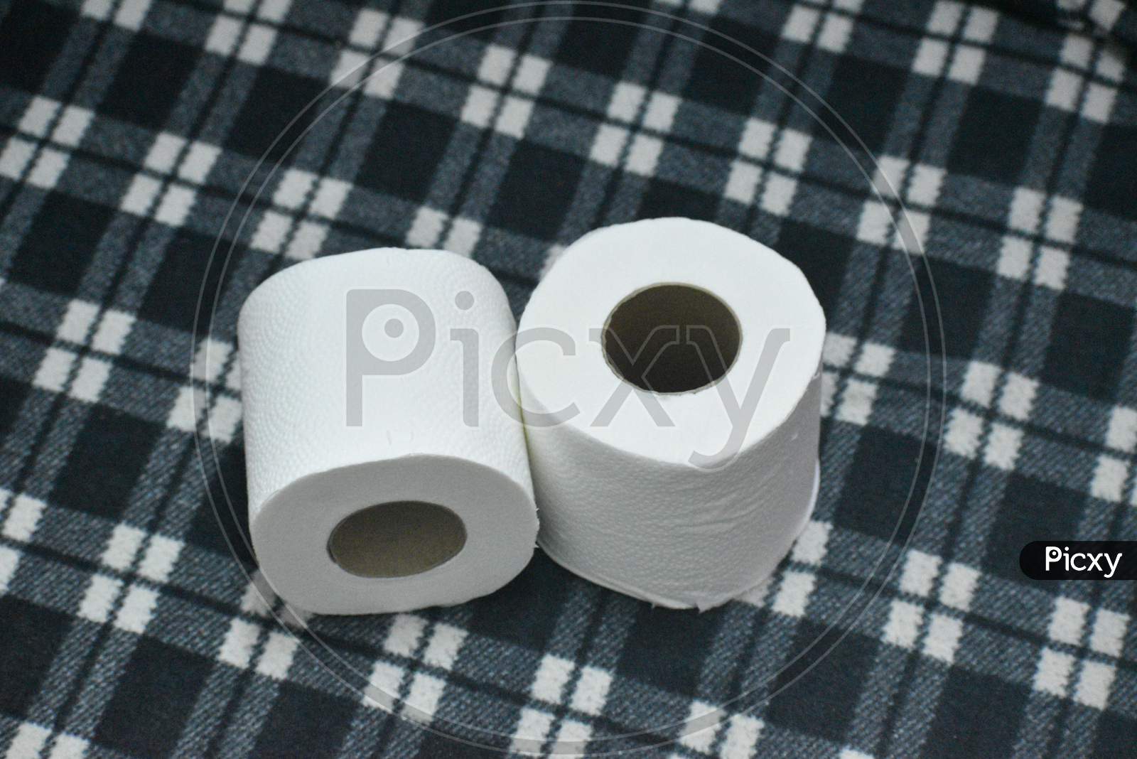 Closeup View Of Toilet Paper Rolls Isolated In Black Background
