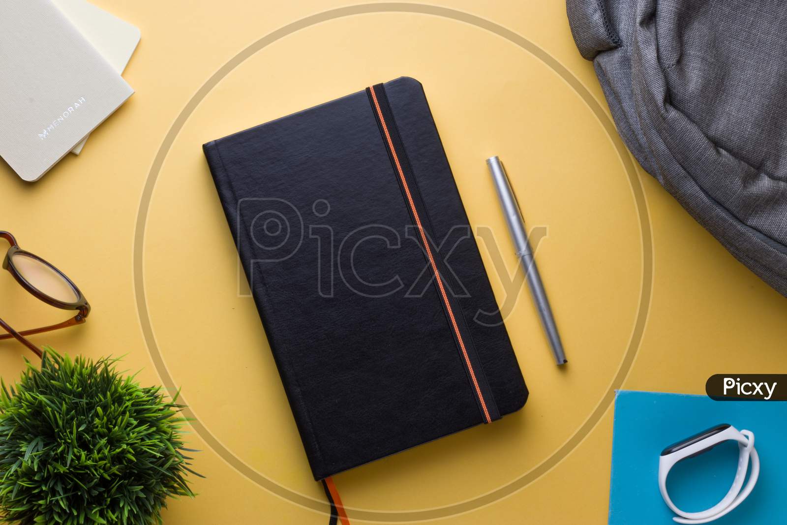 pocket journals, diaries,notebooks, pen, watch and glasses stock photo shoot