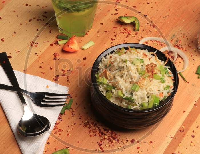 Mix vegetables with rice and shrimp on wood background