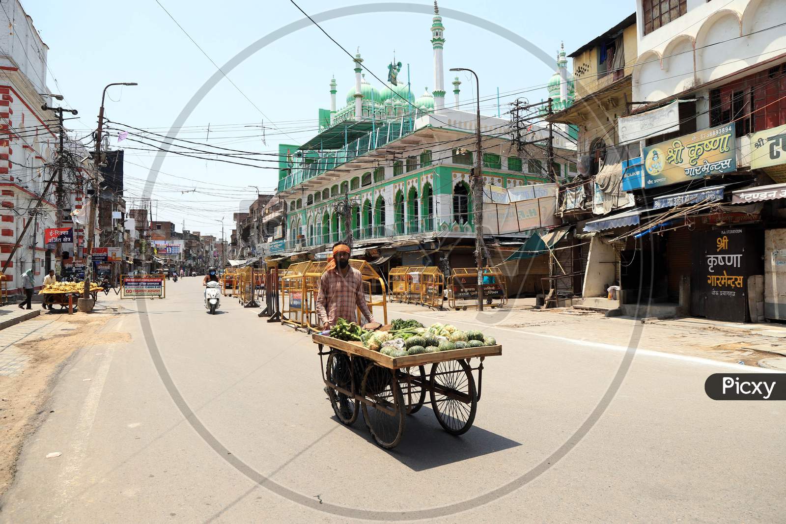 A vendor selling onion on an empty road during a government-imposed nationwide lockdown as a preventive measure against the COVID-19 or Coronavirus, in Prayagraj on  May 3, 2020.