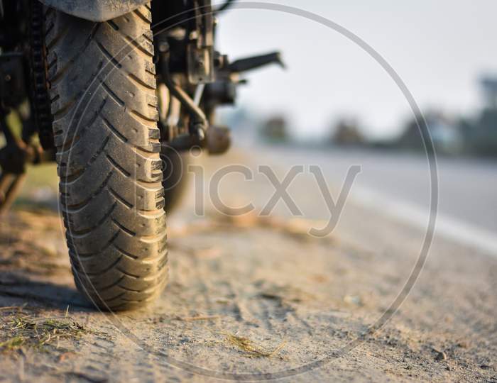 a closeup of sport bike Tyre and bike in a highway