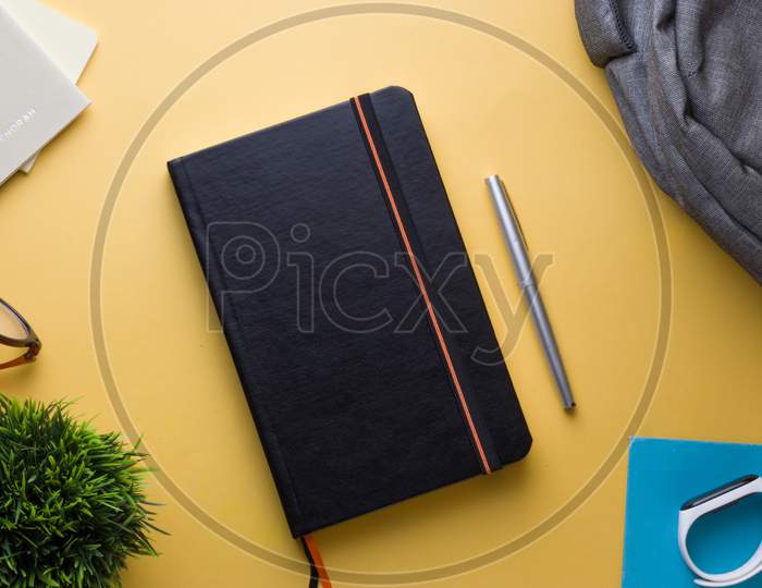 pocket journals, diaries,notebooks, pen, watch and glasses stock photo shoot
