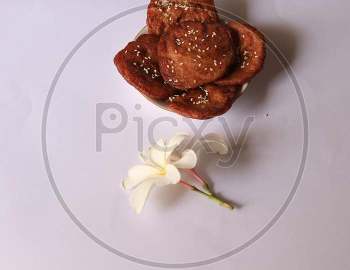 Indian Sweet Savory Arisaelu Made With Jaggery and Rice Flour On Isolated Background