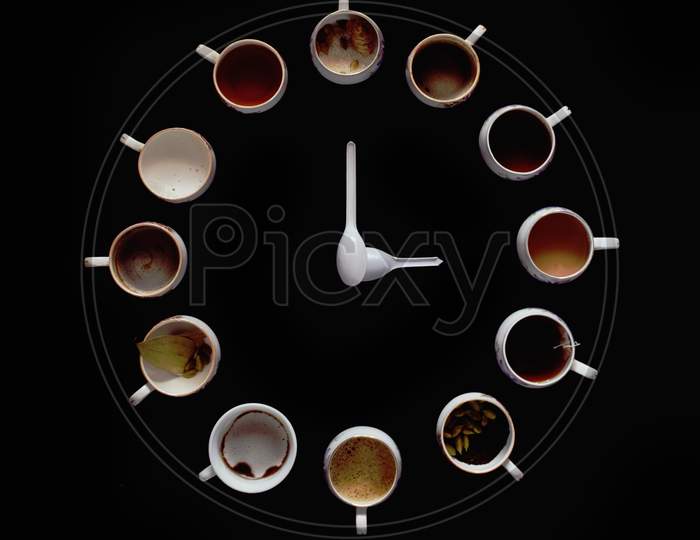 twelve cups with various tea ingredients on a black background