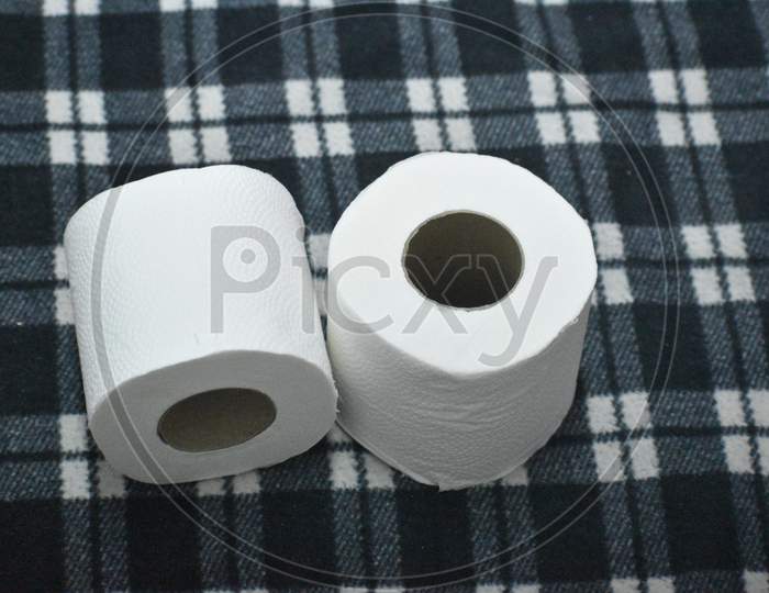 Closeup View Of Toilet Paper Rolls Isolated In Black Background