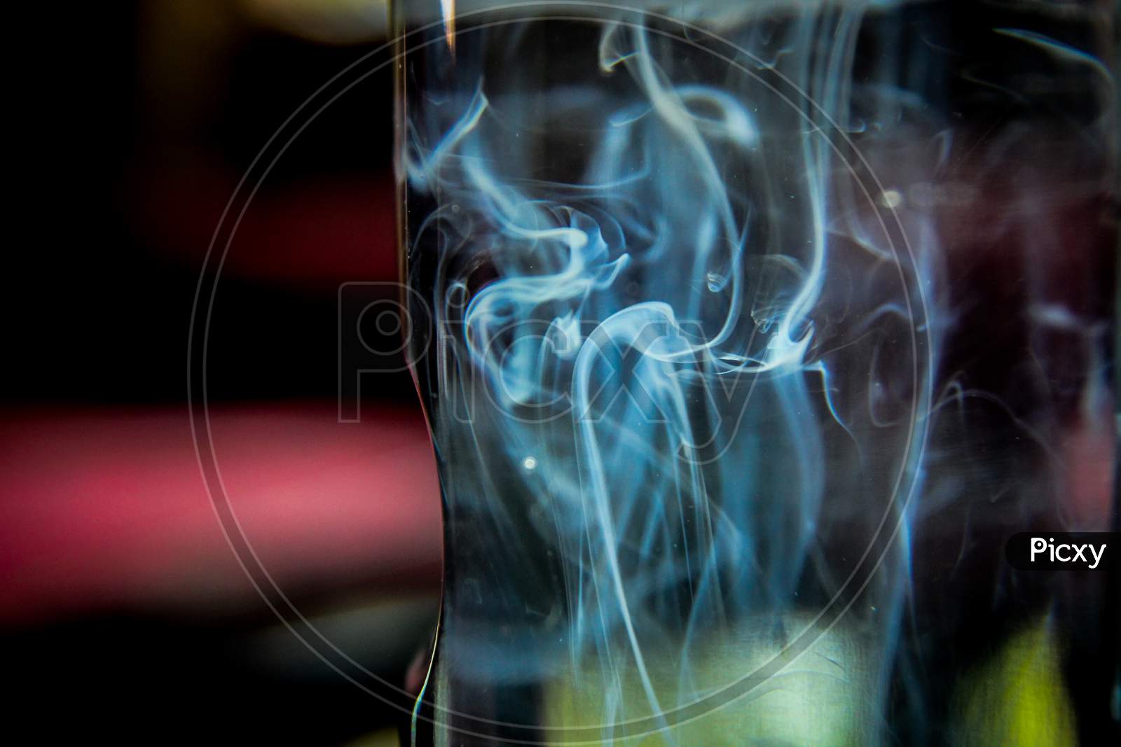 Chemical solution in water, chemical composition creates smokey pattern into the water, a medicine testing in a medical lab, blurry images with selective focus point on smokey effect