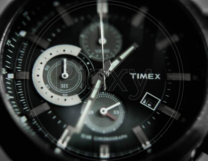 Kolkata, West Bengal, India - February 2020: Macro photography of wrist watch, Timex chronograph watch, close up shot of watch, selective focus on watch dials.