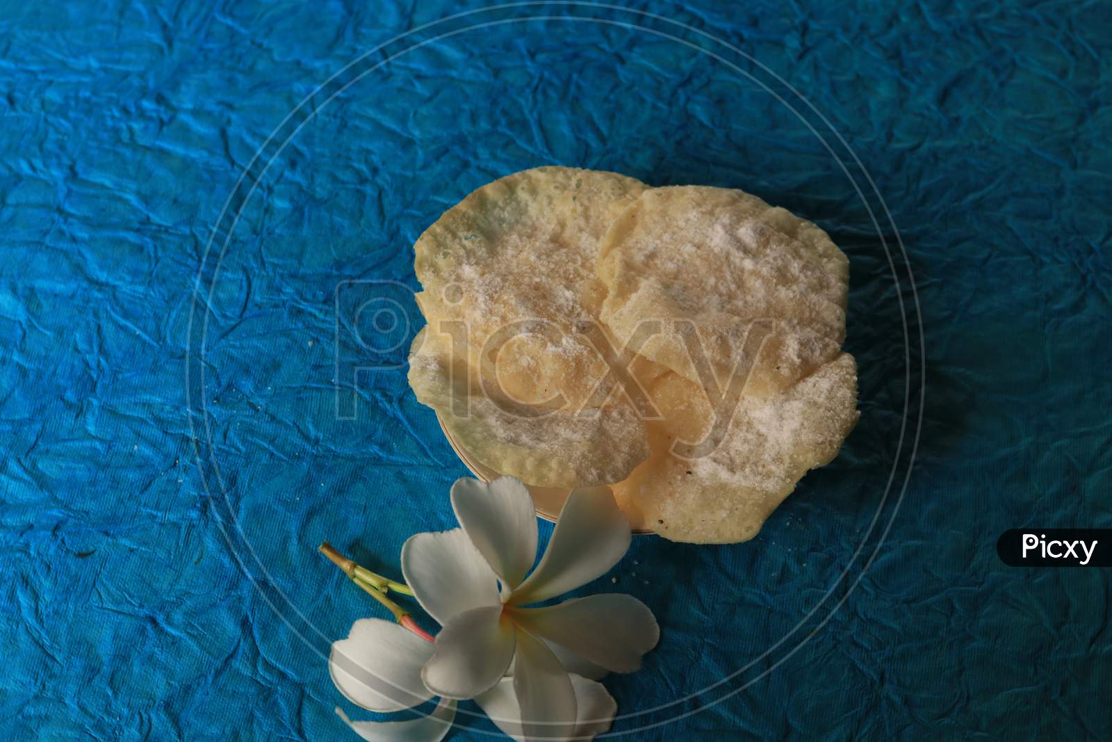 Indian Sweet Savory or Snack Sugar Soaked Poori or Puri On Isolated Background