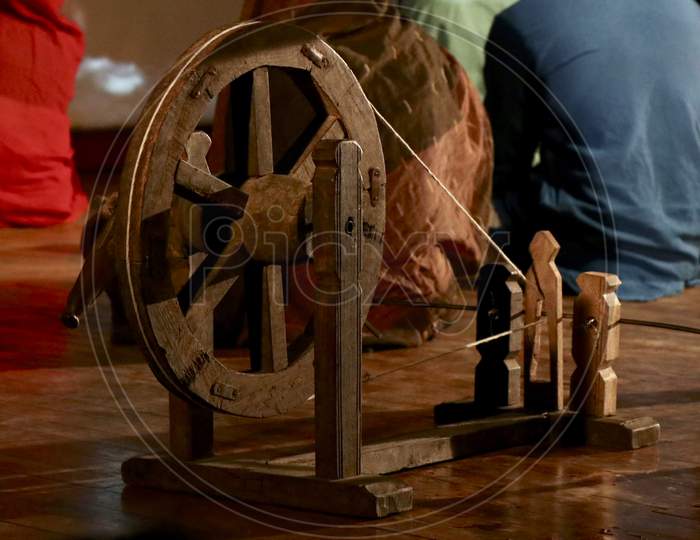 A spinning wheel charkha is a device for spinning thread or yarn from fibres
