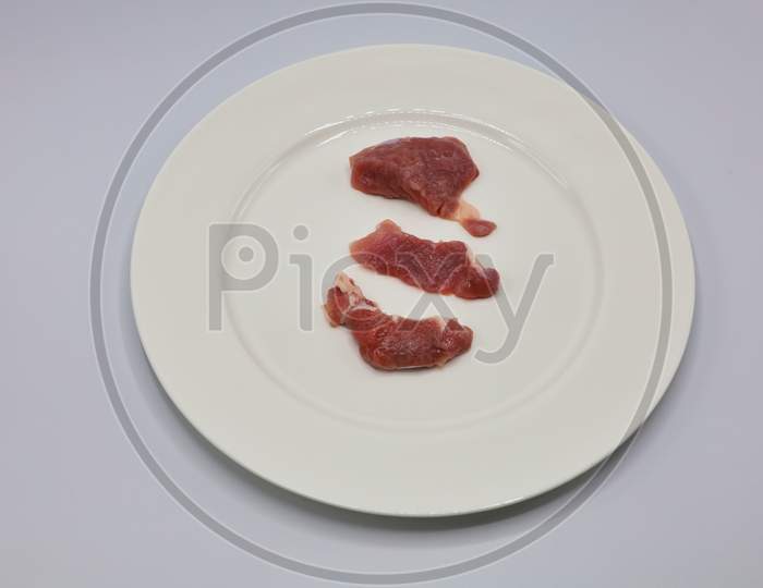 Meat, pork, slices pork loin on a white background