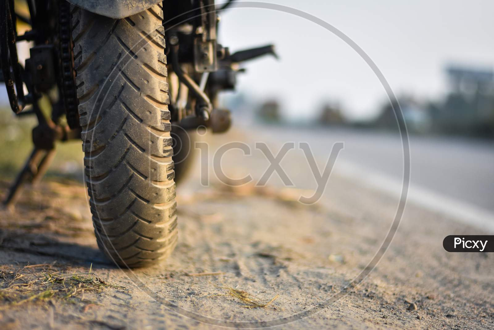 a closeup of sport bike Tyre and bike in a highway
