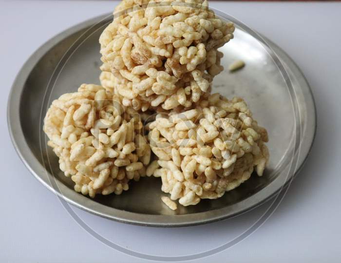 Puffed rice laddu isolated on a white background
