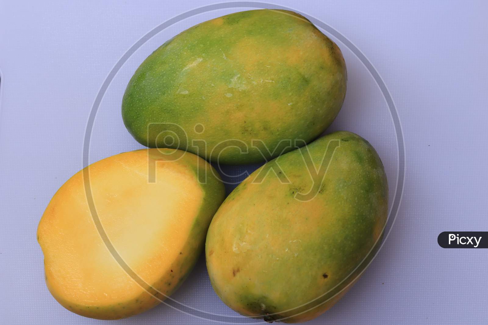 Fresh Yellow Mango fruit isolated on white background
