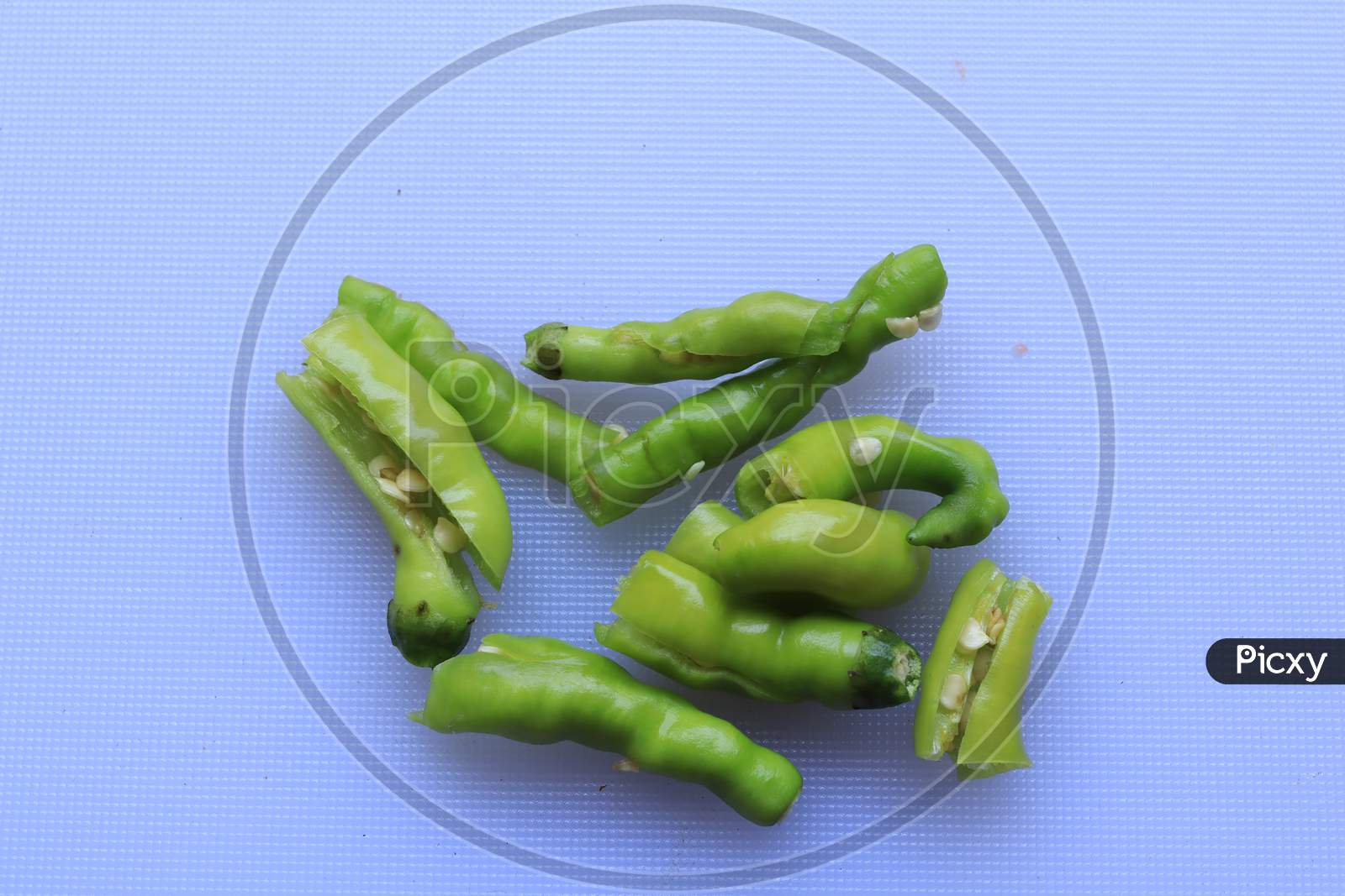 green cayenne pepper with a white background