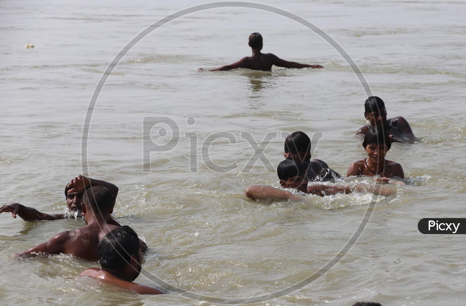 Hindu Devotees Taking Holy Dip in Triveni Sangam River On a Hot Summer Day in Prayagraj on May 30,2020