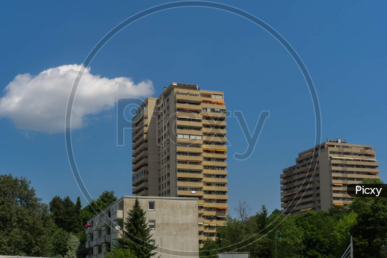 Two Old Apartment Towers On A Bright Summer Day