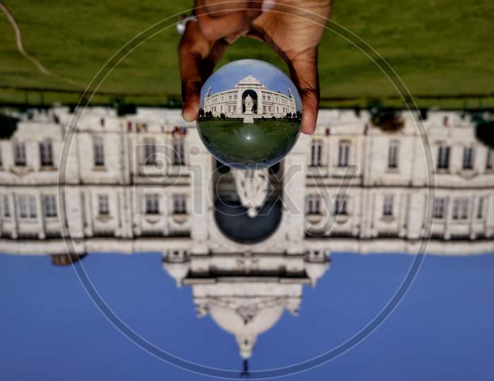 The inverted image of Victoria Memorial through a lensball.