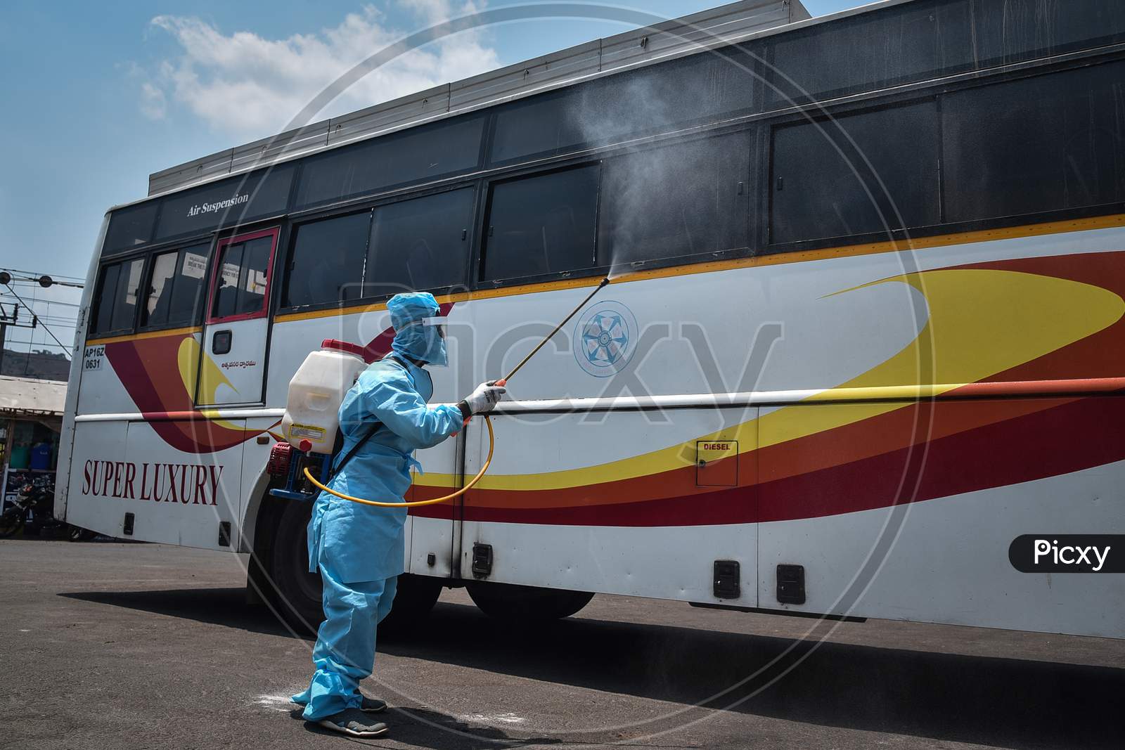 A Corporation Worker Sanitizes An APSRTC Bus, During The Ongoing Coronavirus Lockdown, In Vijayawada.