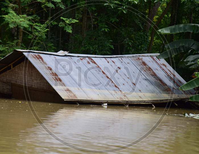 Partially Submerged Houses At A Flood-Affected Village In Hojai District Of Assam On May 30,2020.