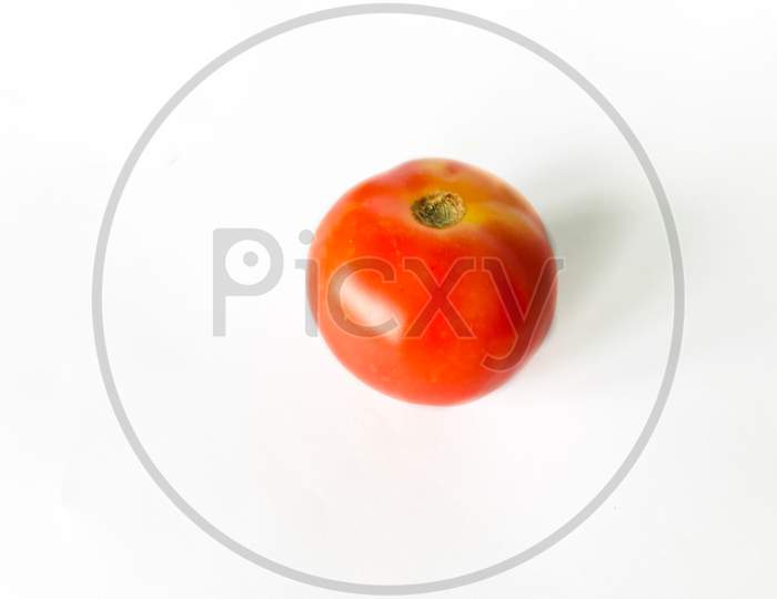A tomato on the white background isolated