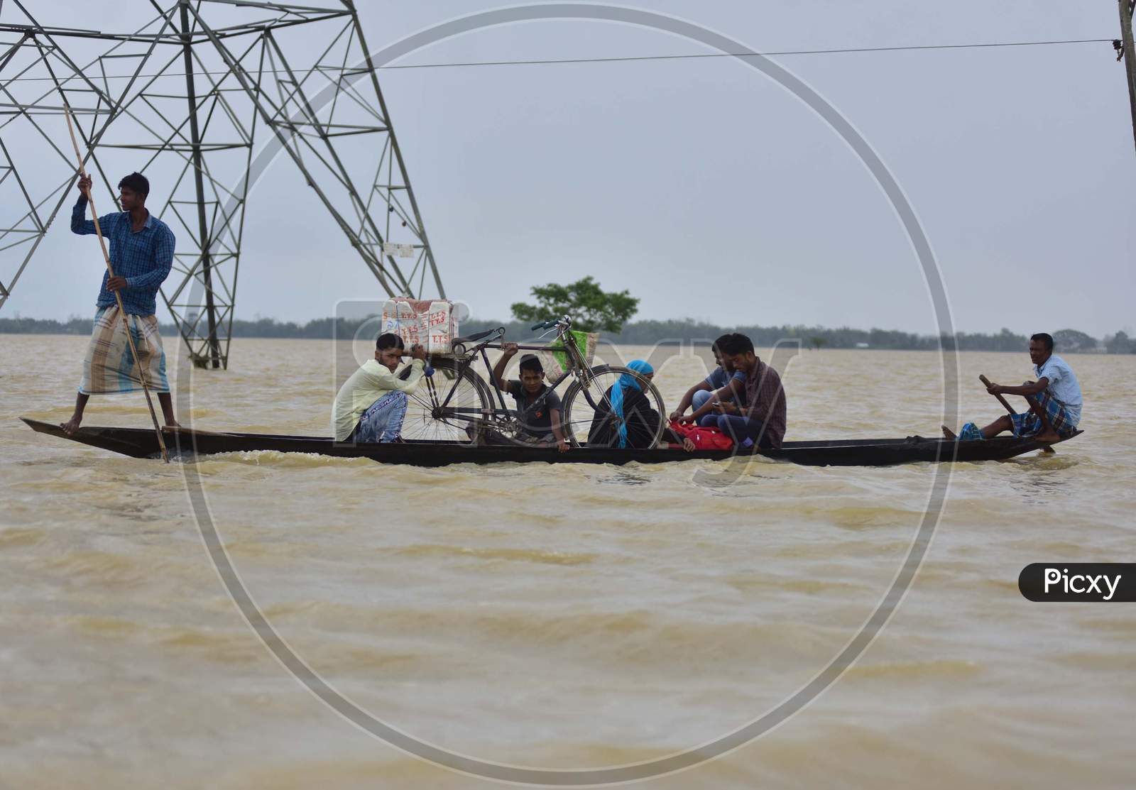Flood Affected Villagers Are Transported on A Boat To A Safer Place In Hojai District of Assam On May 30,2020.