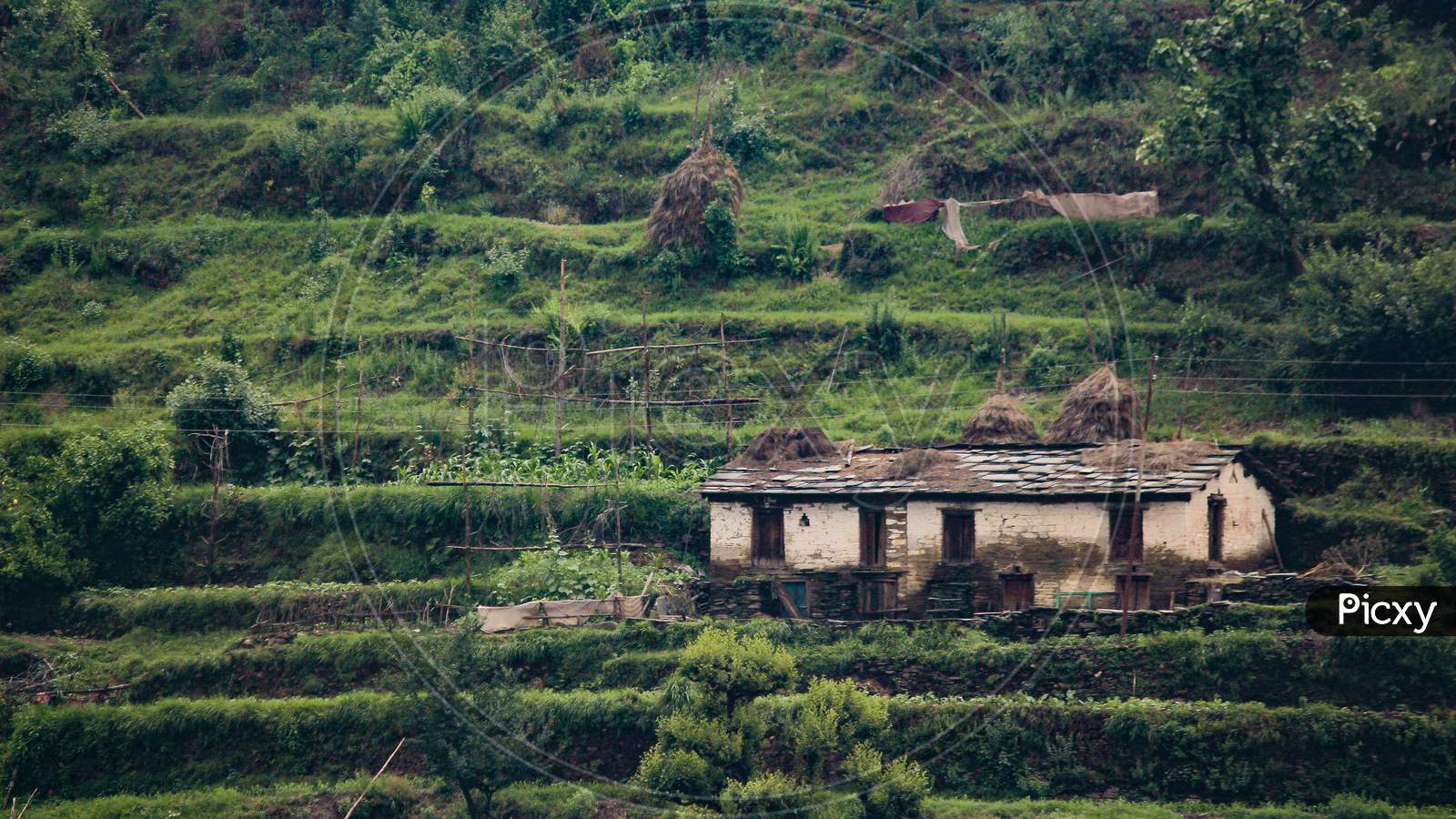 A Landscape Of A Hut House In The Mountains, Old And Traditional Way Of Building Houses.