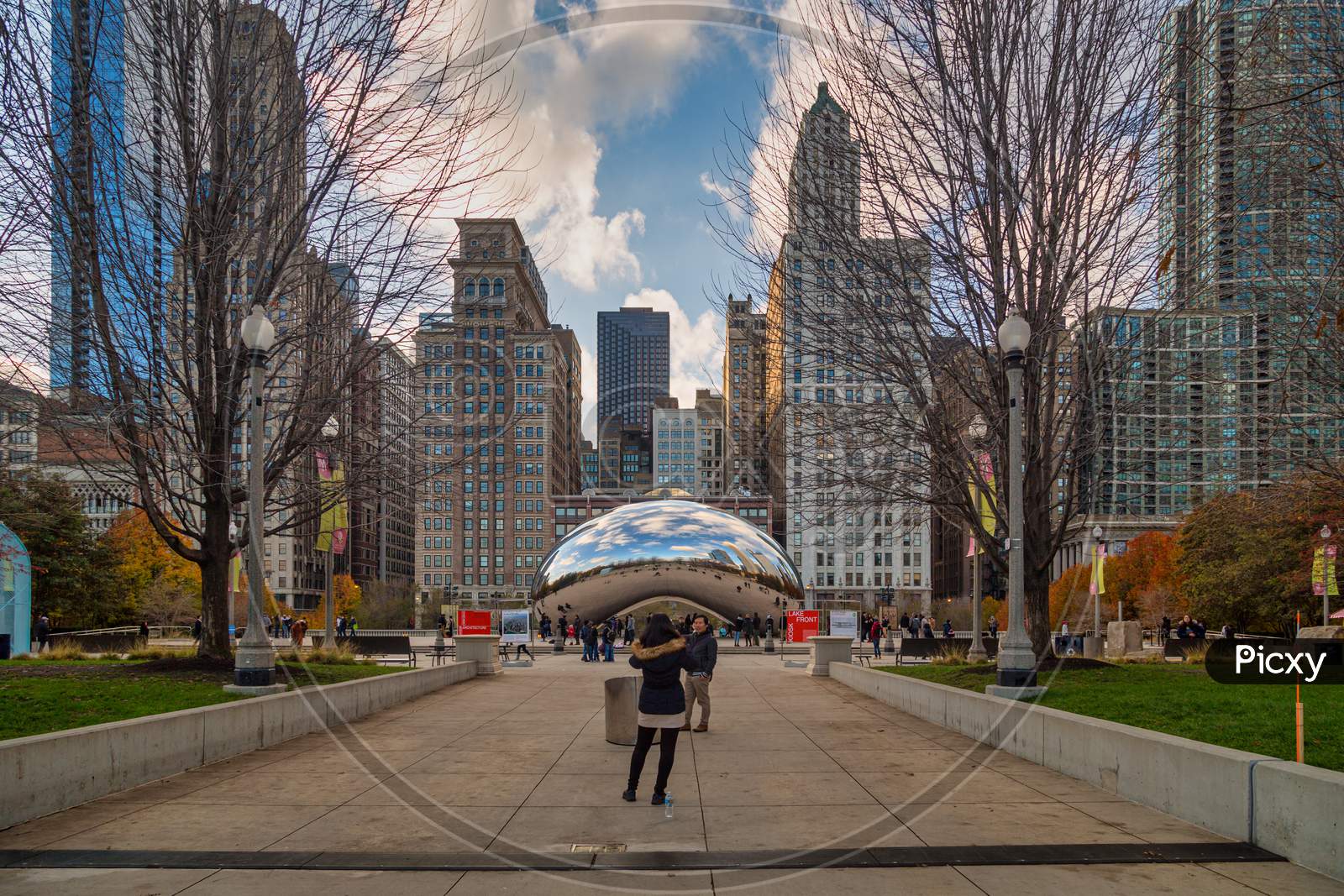Cloud Gate (The bean) at Millennium Park , Chicago with skyline in the background Daylight view.