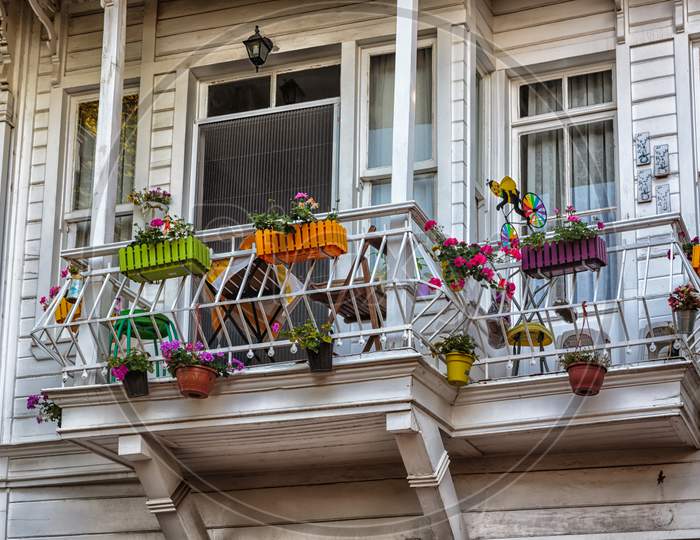 Beautiful white wooden balcony with flowers