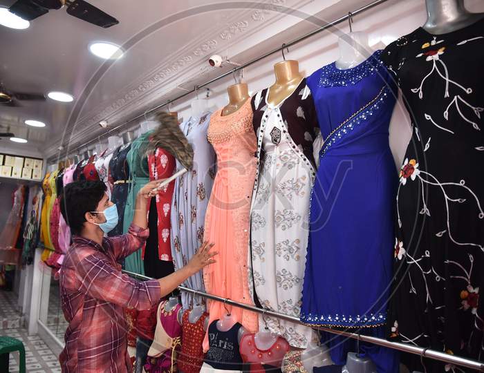A Salesman Works At A Clothing Store, Following The Relaxation Of Restrictions For Shopkeepers, During The Ongoing Coronavirus Lockdown, In Vijayawada.