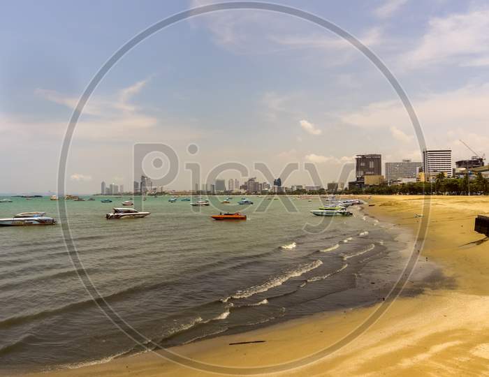 Pattaya,Thailand - April 10,2019:The Beach This Is The Beach Of The City.There Are A Lot Of Small Boats Which Transports Tourists To The Islands Koh Larn And Koh Sak.