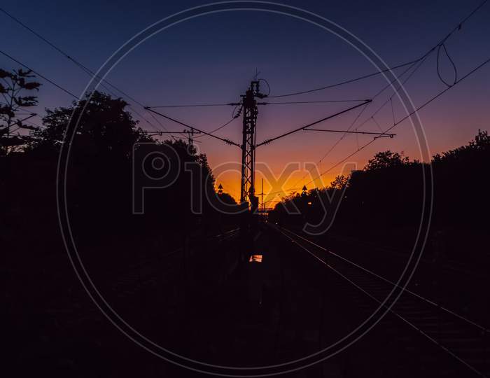 View To A Colorful Sunrise From The Platform Of A Train Station