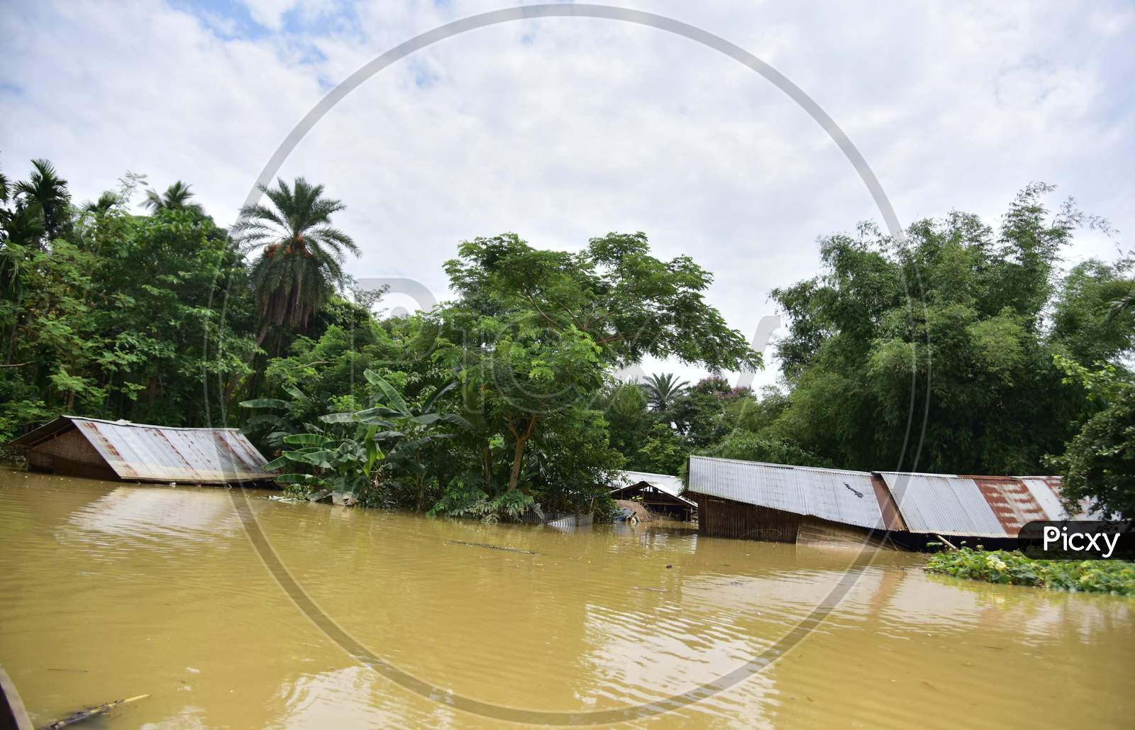 Partially Submerged Houses At A Flood-Affected Village In Hojai District Of Assam On May 30,2020.