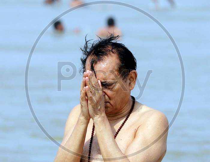 Hindu Devotee Offering Prayers To Holy River Triveni Sangam After Holy Dip  In Prayagraj On May 30,2020