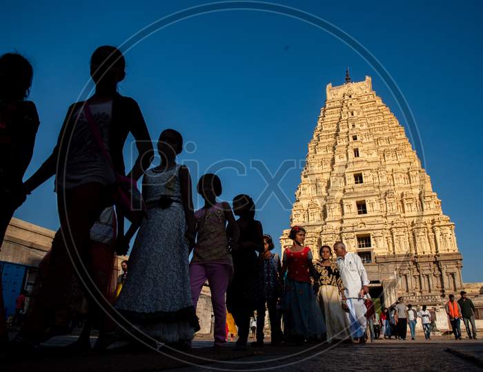 Selective Focus on Virupaksha Temple Gopuram with People walking in Foreground
