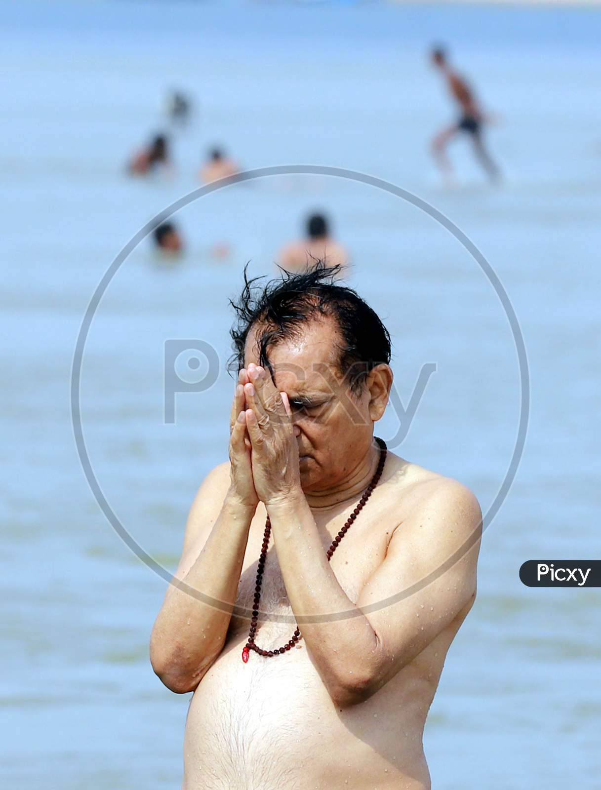 Hindu Devotee Offering Prayers To Holy River Triveni Sangam After Holy Dip  In Prayagraj On May 30,2020
