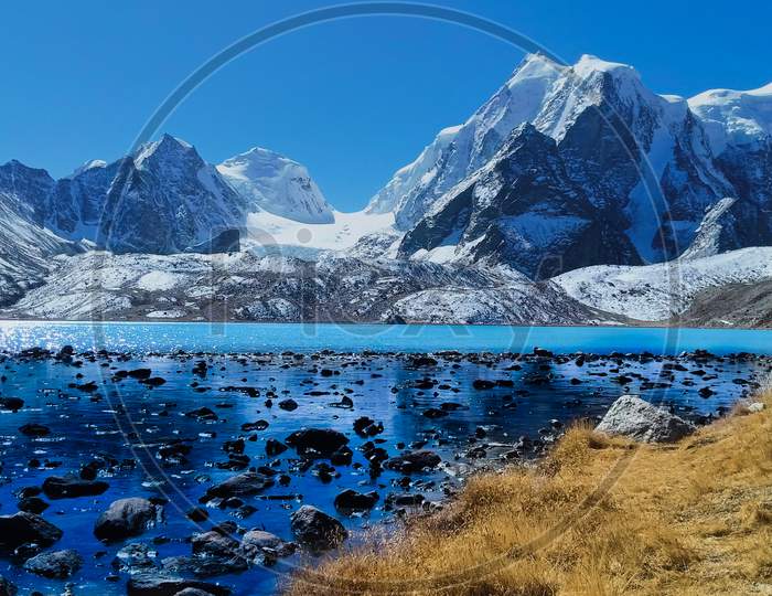 Closest View Of Gurudongmar Lake With Mountain In North Sikkim.
