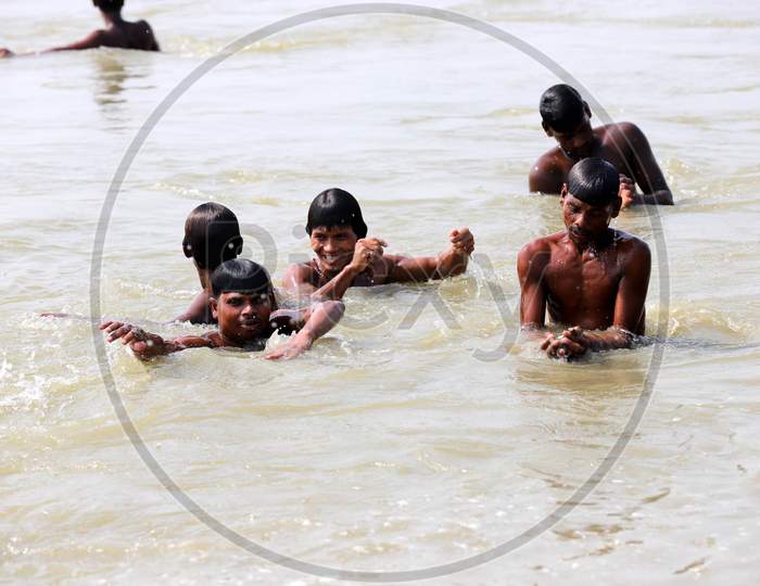 Hindu Devotees Taking Holy Dip in Triveni Sangam River On a Hot Summer Day in Prayagraj on May 30,2020