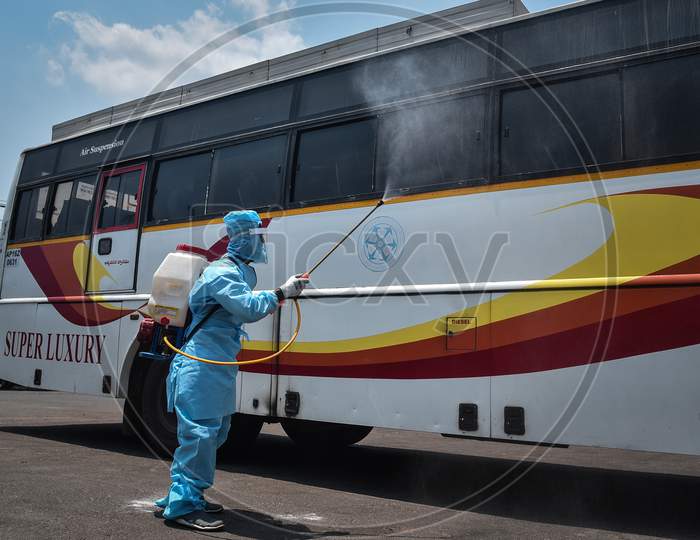 A Corporation Worker Sanitizes An APSRTC Bus, During The Ongoing Coronavirus Lockdown, In Vijayawada.