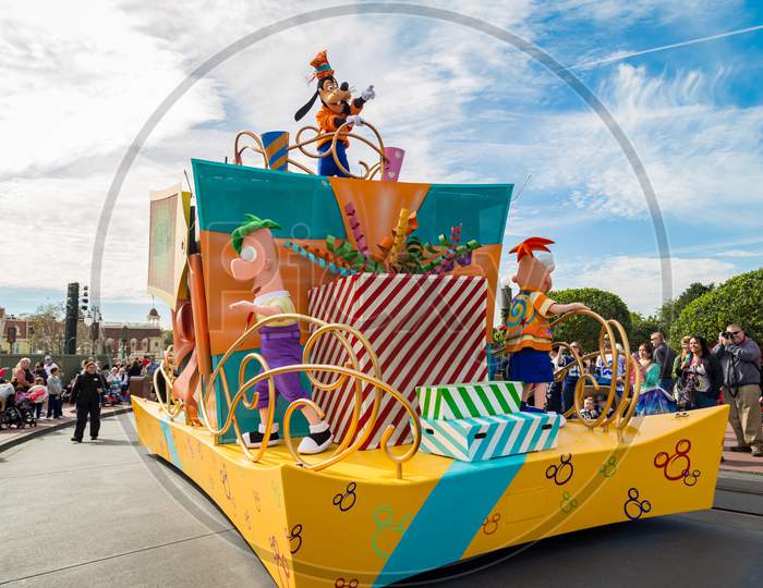 Disney main character Goofy Surprise Celebration parade on Main Street in Magic Kingdom at Walt Disney World in Orlando Florida.