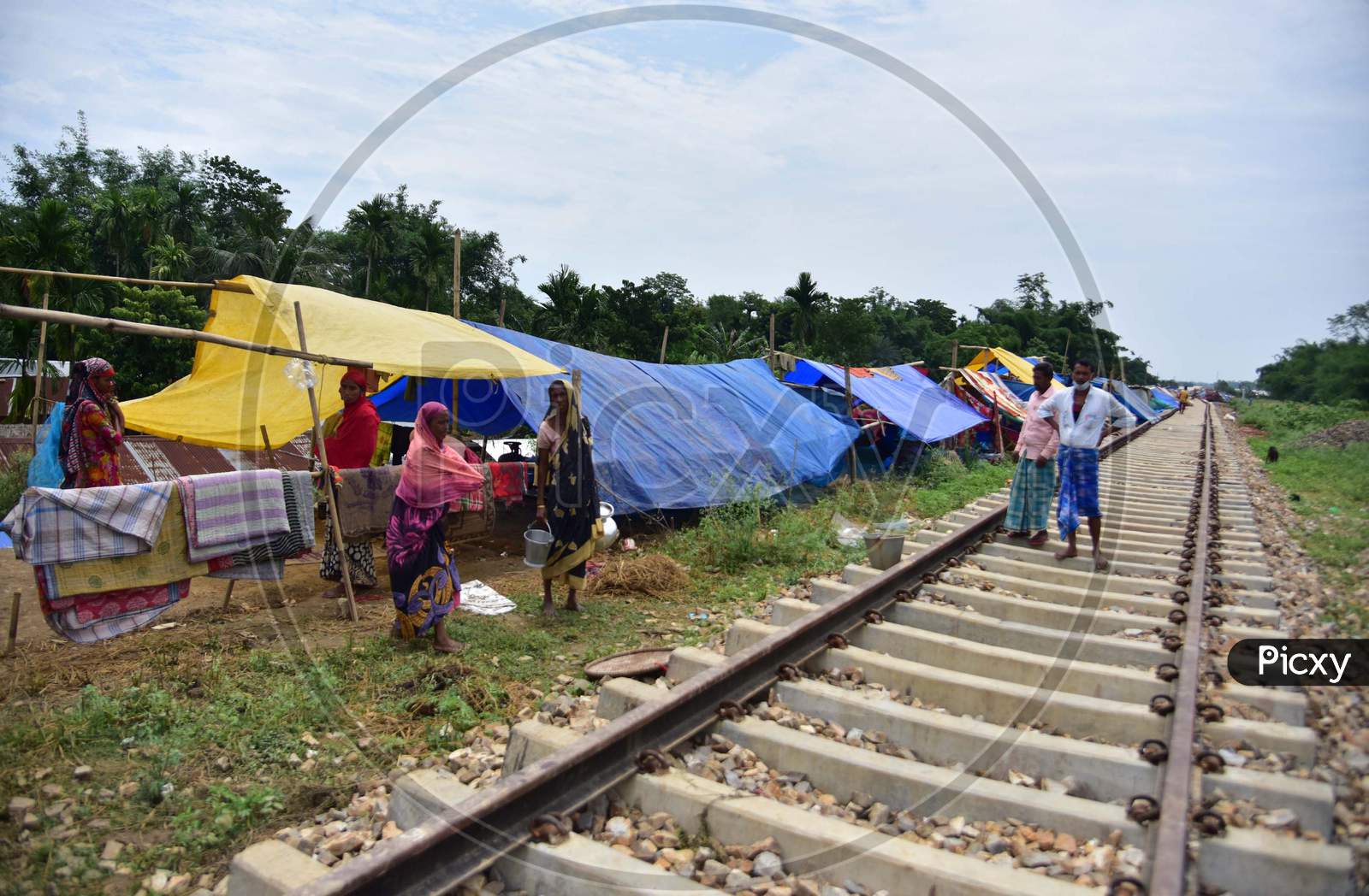 Flood Affected  Villagers at their  Makeshift Shelter  Near A Railway Track In Hojai District Of Assam On May 30,2020.