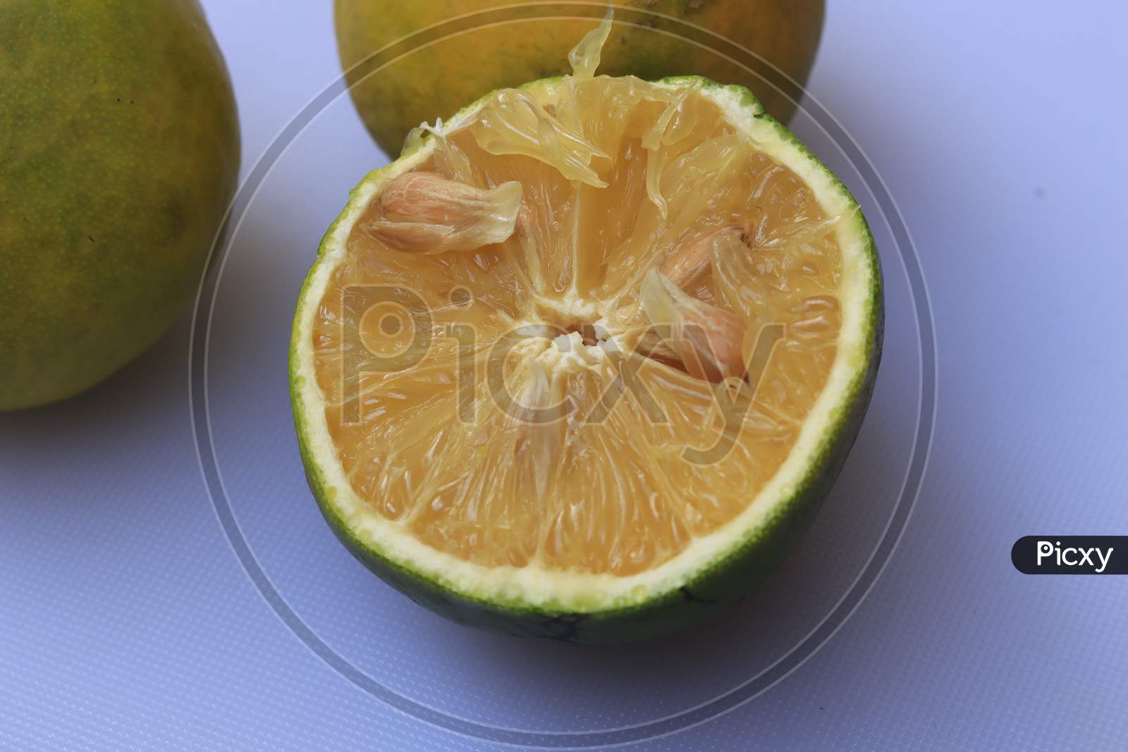 Yellow and green color whole ripe Sweet lime fruits or Citrus limetta