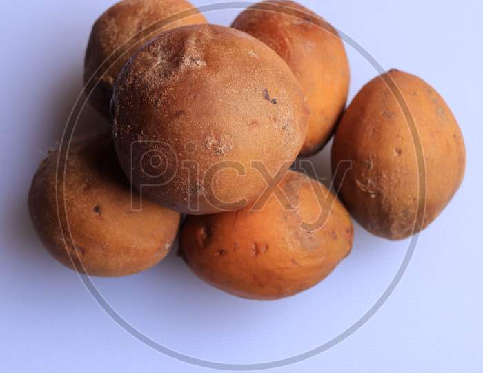 Ripe fresh sapota fruits isolated on white background