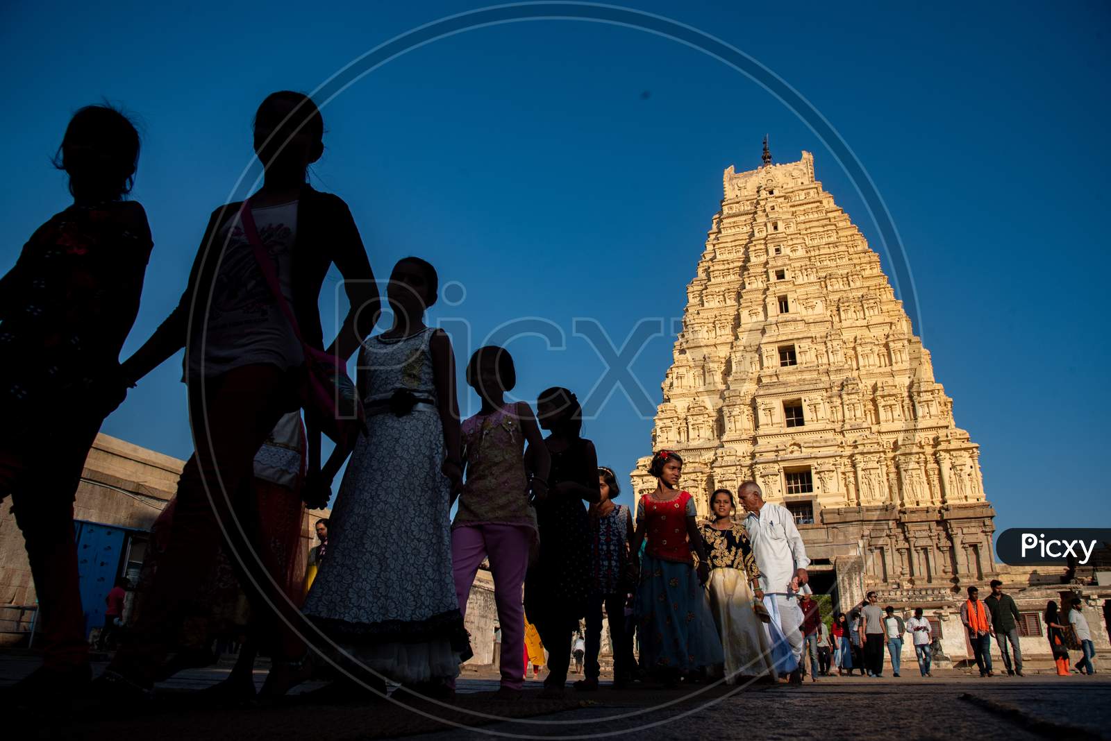 Selective Focus on Virupaksha Temple Gopuram with People walking in Foreground